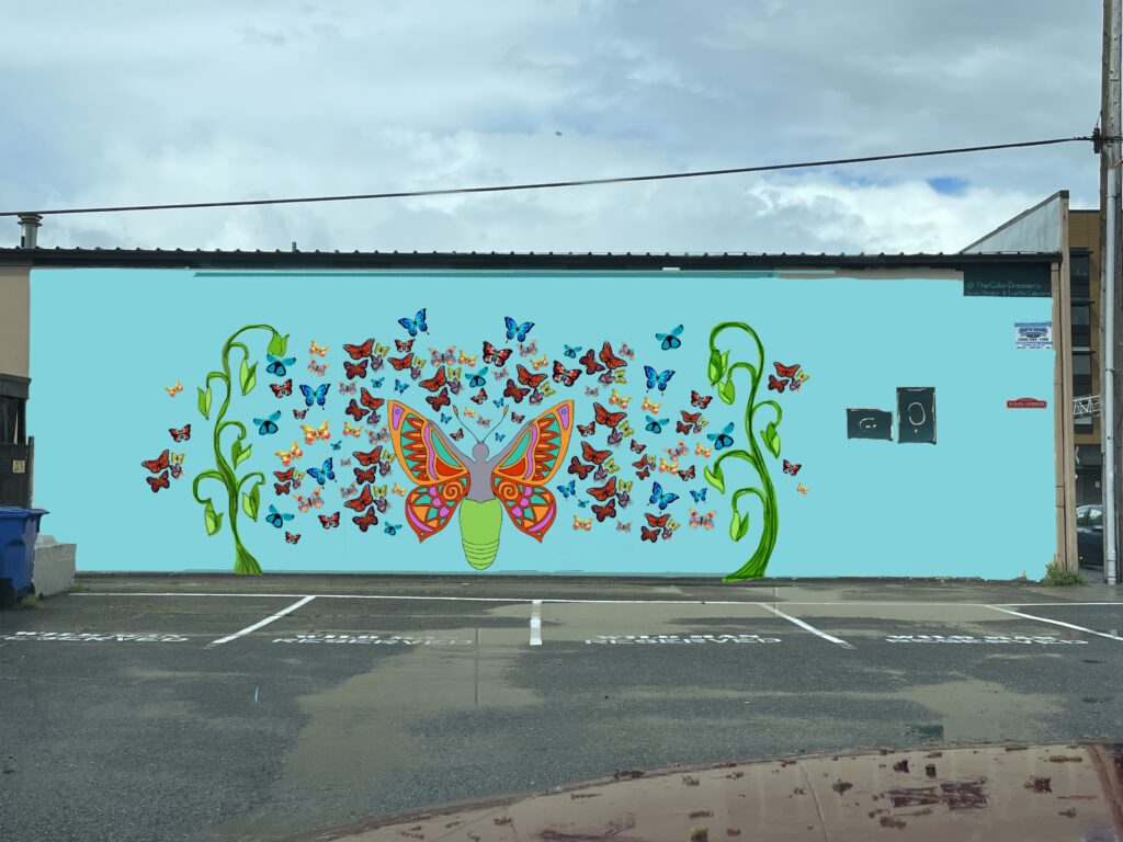 blue building with design of a large butterfly surrounded by many small mosaic butterflies