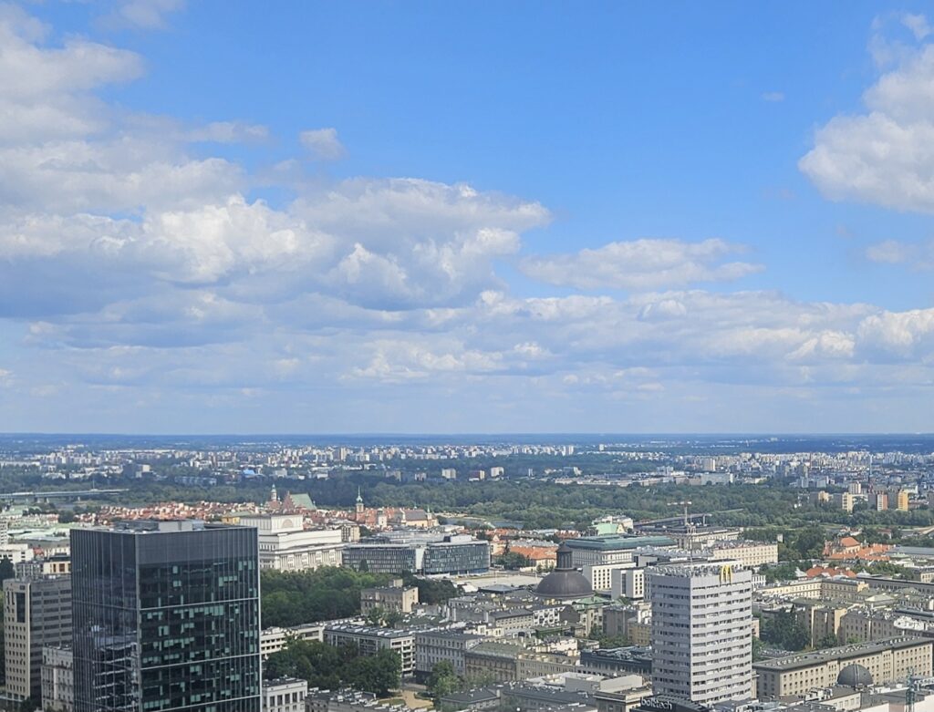 Warsaw skyline with Old Town in the middle distance.