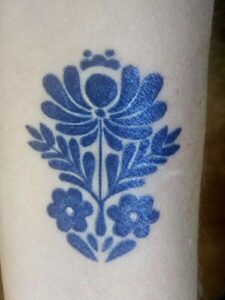A small tattoo in Polish traditional style.